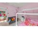 A pink themed bedroom features a playful reading nook at 1715 Capstone Dr, Durham, NC 27713