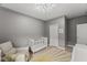 Light and airy Bedroom with crib and patterned rug at 1715 Capstone Dr, Durham, NC 27713