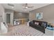 Bonus room with a gray sofa, toy kitchen, and polka dot carpet at 1715 Capstone Dr, Durham, NC 27713