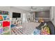 Spacious bonus room features a TV, shelves, and playful decor at 1715 Capstone Dr, Durham, NC 27713