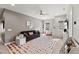 Bright bonus room featuring a gray couch and colorful polka dot rug at 1715 Capstone Dr, Durham, NC 27713