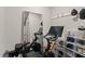 Bright exercise room featuring Peloton bike, mirror, and storage for an active lifestyle at 1715 Capstone Dr, Durham, NC 27713