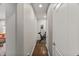 Hallway leading to a workout area with a bike and hardwood flooring at 1715 Capstone Dr, Durham, NC 27713