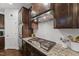 Modern kitchen features granite countertops, stainless appliances, and subway tile backsplash at 1715 Capstone Dr, Durham, NC 27713