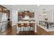 Stylish kitchen with stainless appliances, spacious island, and adjacent dining area at 1715 Capstone Dr, Durham, NC 27713