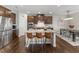 Open kitchen featuring stainless steel appliances, a large island, and stylish seating at 1715 Capstone Dr, Durham, NC 27713