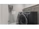 Modern laundry room featuring a side-by-side washer and dryer for convenience at 1715 Capstone Dr, Durham, NC 27713