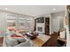 Cozy living room showcasing a fireplace, built-in bookcases, and backyard views at 1715 Capstone Dr, Durham, NC 27713