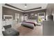 Spacious main bedroom with decorative ceiling, ensuite bathroom, and ample natural light at 1715 Capstone Dr, Durham, NC 27713