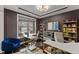 Comfortable home office with window views, two desks, and organized shelving at 1715 Capstone Dr, Durham, NC 27713