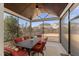 Comfortable screened porch with dining table and chairs, offers outdoor relaxation at 1715 Capstone Dr, Durham, NC 27713