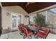Comfortable screened porch with dining table and chairs for outdoor relaxation at 1715 Capstone Dr, Durham, NC 27713