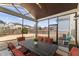 Comfortable screened porch with dining table and chairs, perfect for outdoor dining and relaxation at 1715 Capstone Dr, Durham, NC 27713
