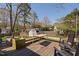 Backyard deck is spacious, including chairs, tables and green space at 202 High St, Carrboro, NC 27510