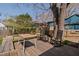 Backyard deck includes seating and shade trees at 202 High St, Carrboro, NC 27510