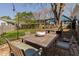 Backyard with outdoor dining area, seating and well-maintained lawn at 202 High St, Carrboro, NC 27510