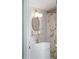 Charming bathroom featuring a vanity, floral shower curtain, and a gold-framed round mirror at 202 High St, Carrboro, NC 27510