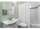Bathroom featuring a bath and shower combo with shower curtain, and a sink with white vanity at 202 High St, Carrboro, NC 27510
