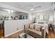 Bright bedroom with hardwood floors, large windows, ceiling fan, and mini split for heating and cooling at 202 High St, Carrboro, NC 27510