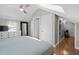 Spacious bedroom with hardwood floors, a ceiling fan, and plenty of natural light from the window at 202 High St, Carrboro, NC 27510