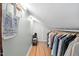 Spacious closet features hanging storage, shelves, and natural lighting at 202 High St, Carrboro, NC 27510