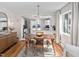 Charming dining room featuring hardwood floors, modern light fixture, and open access to the kitchen area at 202 High St, Carrboro, NC 27510