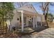 Charming cottage with a quaint front porch featuring wooden chairs and cozy outdoor seating at 202 High St, Carrboro, NC 27510