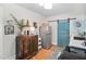 Galley kitchen with decorative sliding door, and stainless steel refrigerator at 202 High St, Carrboro, NC 27510