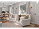 Bright living room seamlessly connects to the dining area, filled with natural light and neutral tones at 202 High St, Carrboro, NC 27510