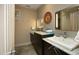 Well-lit bathroom with dual sinks, granite countertops, and modern fixtures at 21 Wedgewood Rd, Chapel Hill, NC 27514