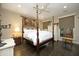 Spacious bedroom with a four-poster bed, ceiling fan, and ample natural light at 21 Wedgewood Rd, Chapel Hill, NC 27514
