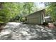 Spacious garage and parking area alongside the house, surrounded by greenery at 21 Wedgewood Rd, Chapel Hill, NC 27514