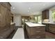 Kitchen with hardwood floors, granite countertops, an island with seating, and stainless steel appliances at 21 Wedgewood Rd, Chapel Hill, NC 27514