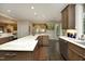 Open kitchen with stainless steel appliances, hardwood floors, granite countertops, and a built-in wine cooler at 21 Wedgewood Rd, Chapel Hill, NC 27514