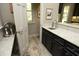 Kitchen area with stone floors, granite counters, custom cabinets, and a stainless steel sink at 21 Wedgewood Rd, Chapel Hill, NC 27514
