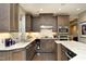 Kitchen with custom wood cabinets, stainless steel appliances, granite countertops, and a neutral color palette at 21 Wedgewood Rd, Chapel Hill, NC 27514
