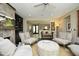 Bright living room featuring plush seating, built-in bookshelves, and elegant decor at 21 Wedgewood Rd, Chapel Hill, NC 27514