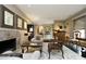 Beautiful living area with comfortable seating, hardwood floors, and a striking fireplace at 21 Wedgewood Rd, Chapel Hill, NC 27514