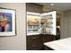 A fully stocked, stainless steel, built-in refrigerator with custom wood paneling at 21 Wedgewood Rd, Chapel Hill, NC 27514