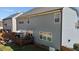 Backyard featuring a wooden deck, seating area, green lawn and solar panels at 2220 Rainy Lake St, Wake Forest, NC 27587