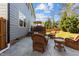 Inviting backyard patio featuring comfortable wicker furniture and a wooden deck, perfect for outdoor relaxation at 2220 Rainy Lake St, Wake Forest, NC 27587