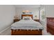 Comfortable bedroom with a bed, bedside tables, and a dresser at 2220 Rainy Lake St, Wake Forest, NC 27587