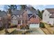 Beautiful brick home with lush landscaping and a driveway at 2220 Rainy Lake St, Wake Forest, NC 27587