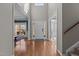 Grand two-story foyer with hardwood floors, a staircase, and a view into the adjacent living spaces at 2220 Rainy Lake St, Wake Forest, NC 27587