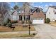 Brick home with a two-car garage and well-manicured front yard at 2220 Rainy Lake St, Wake Forest, NC 27587