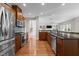 Modern kitchen with stainless steel appliances, granite countertops, and hardwood floors at 2220 Rainy Lake St, Wake Forest, NC 27587