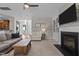 Inviting living room featuring a fireplace, built-in shelves, and neutral tones at 2220 Rainy Lake St, Wake Forest, NC 27587