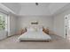 Large main bedroom featuring tray ceilings, natural light, and a neutral color palette at 2220 Rainy Lake St, Wake Forest, NC 27587