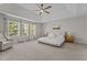 Spacious main bedroom with high ceilings, large windows, and neutral decor at 2220 Rainy Lake St, Wake Forest, NC 27587