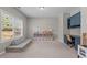 Play room with blue cabinetry, a work desk, and ample natural light from a large window at 2220 Rainy Lake St, Wake Forest, NC 27587